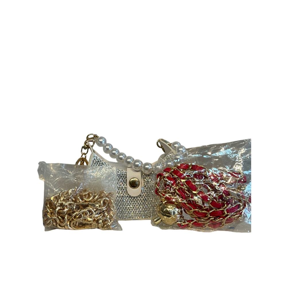 #90 Ret. $70 White Bag Charm Blinged out, Red crossbody chain and gold acrylic
